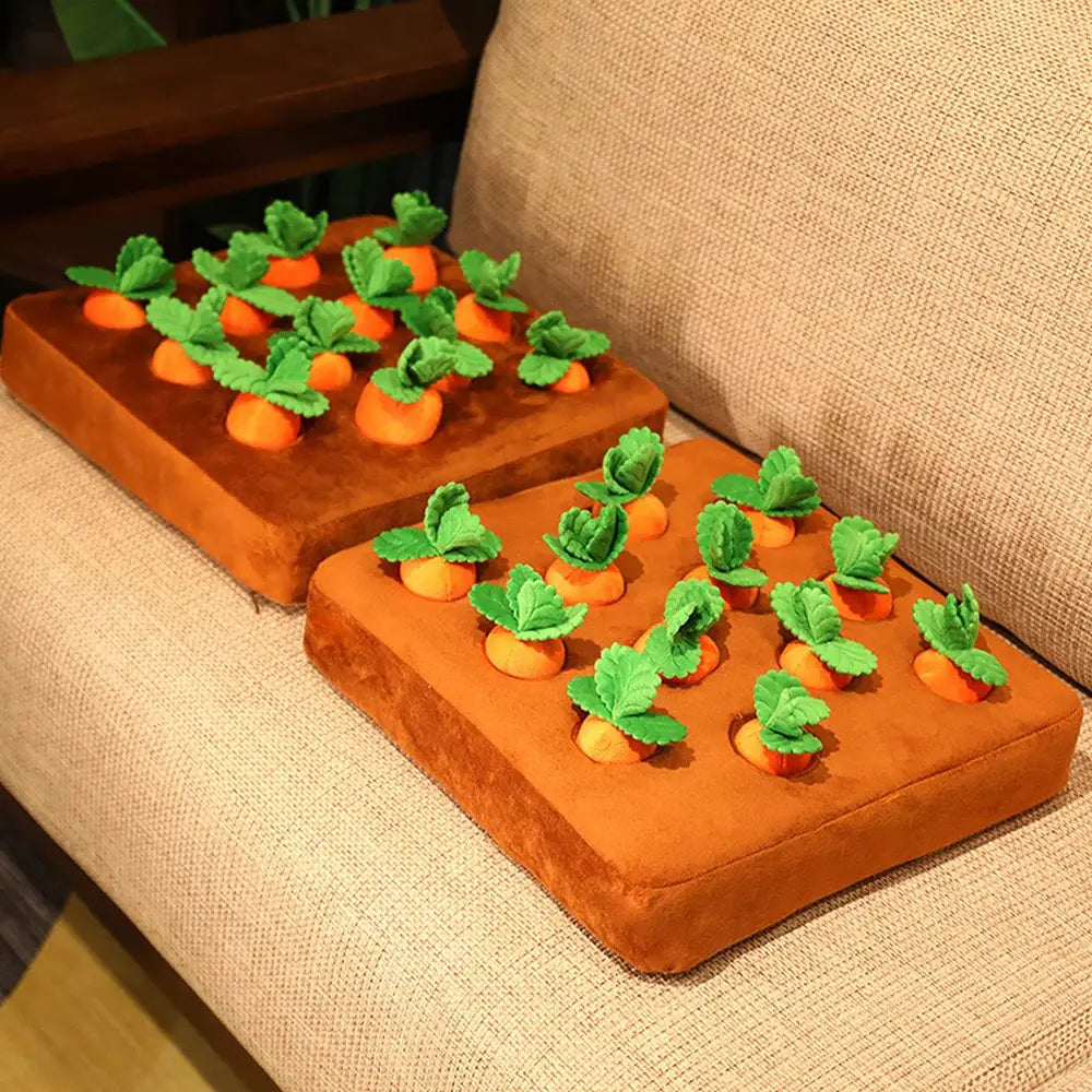 Two rectangular cakes decorated with orange frosting and small green and orange carrot-shaped candies on top.