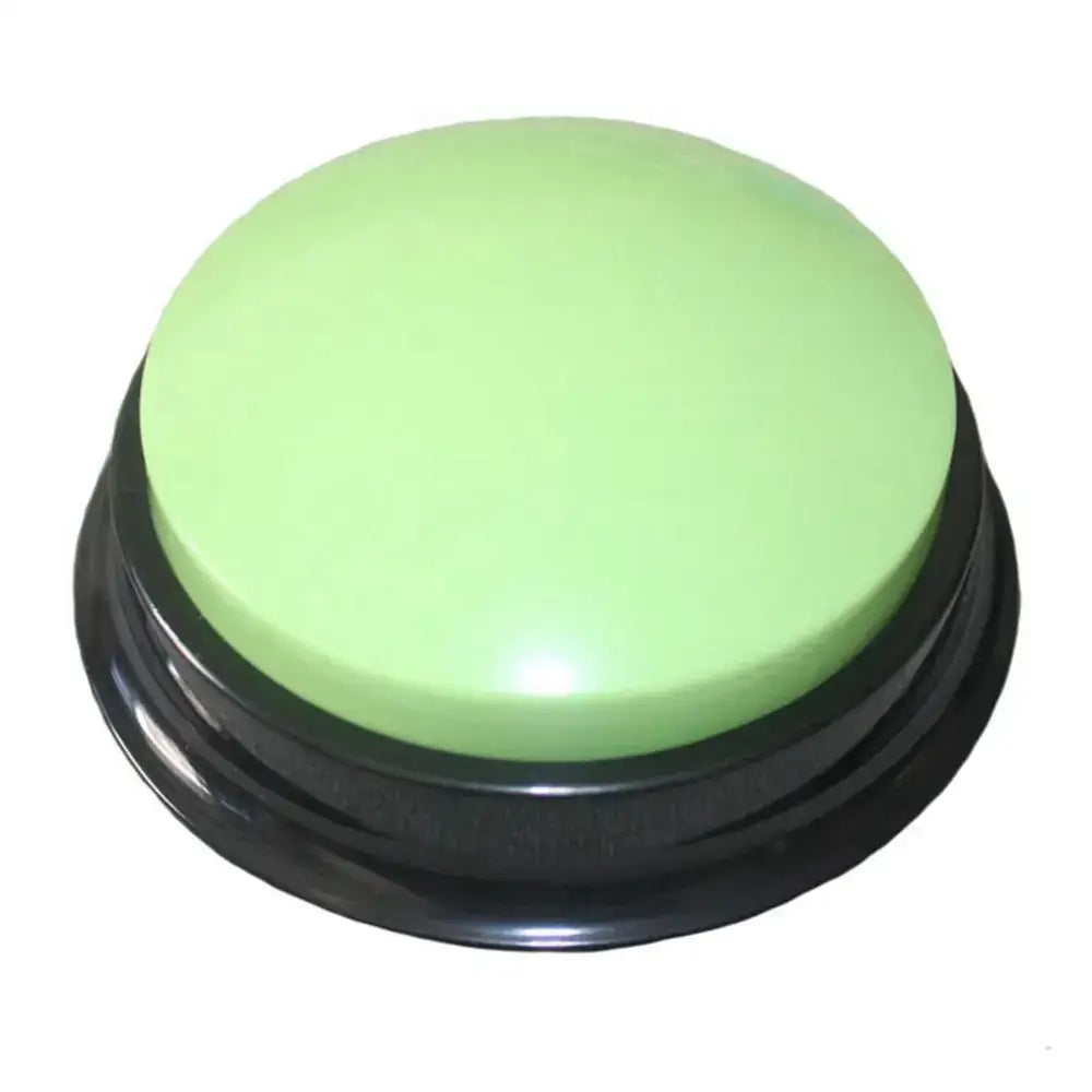 Light green circular button with a black base.