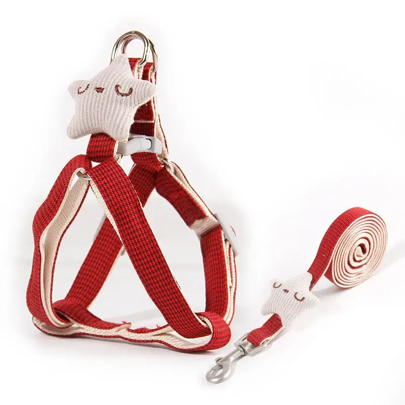 Red and white dog harness with matching leash.