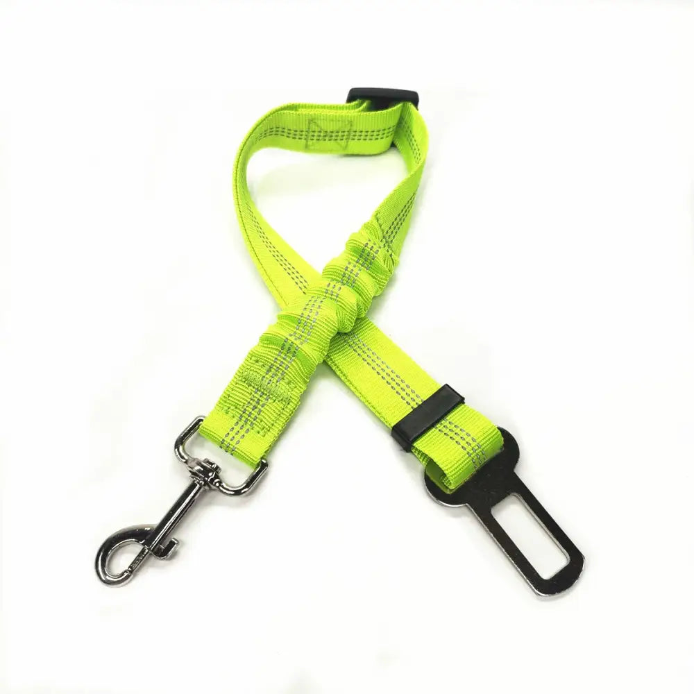 Bright neon green dog seatbelt with metal clip and adjustable buckle.