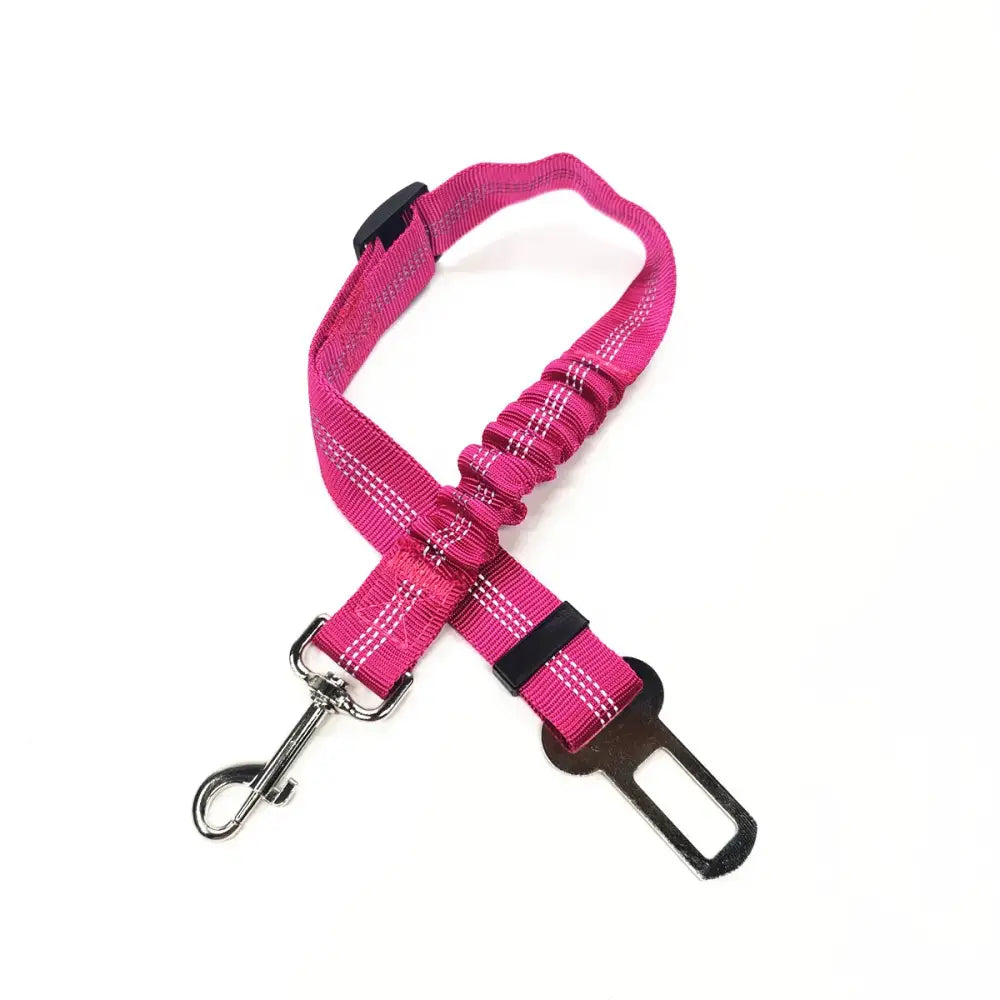 Bright pink adjustable dog seatbelt with metal clip attachment.