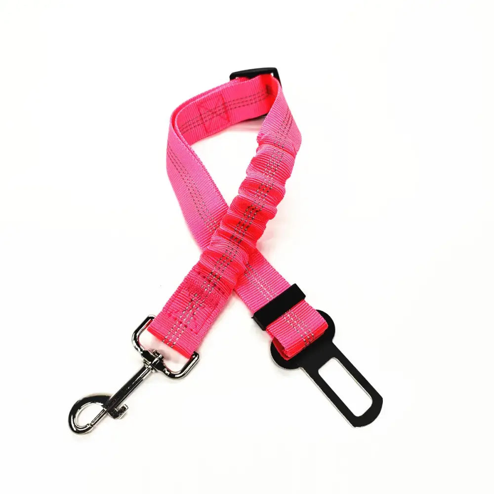 Pink adjustable dog seatbelt with a metal clip attachment.