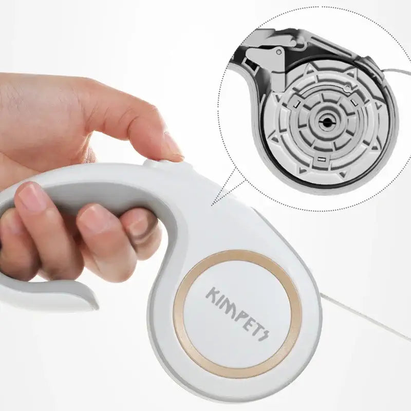 Handheld electronic device with a circular design and grip handle.