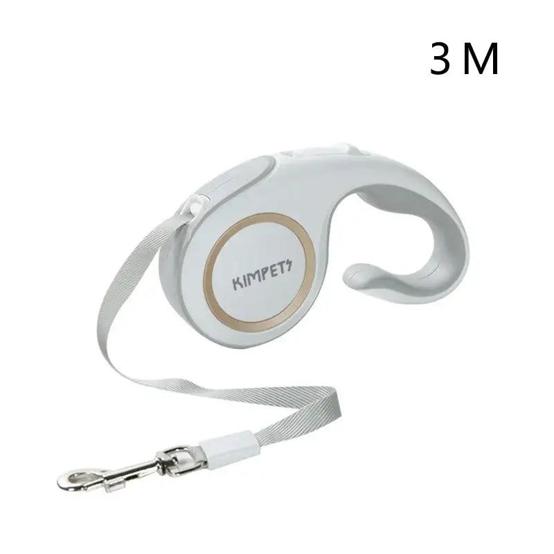 Retractable dog leash with a white and gold circular housing.