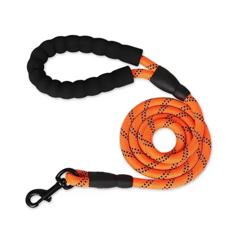 Dog leash with a braided orange rope and black padded handle.