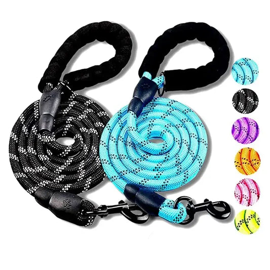 Dog leashes made of braided rope in black and blue colors with padded handles.