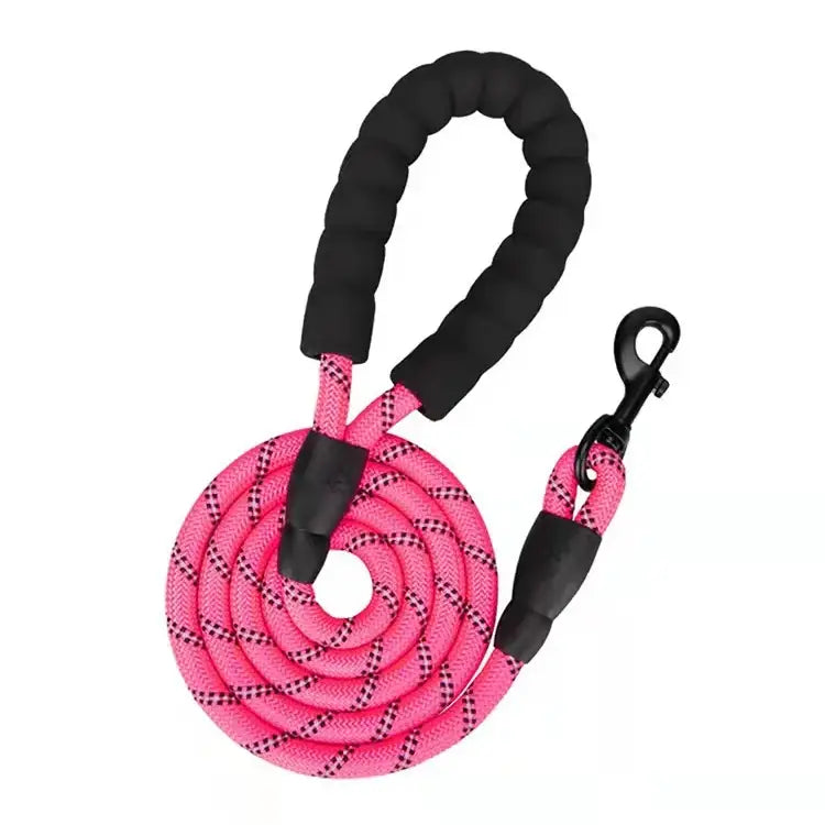 Pink and black braided dog leash with a padded handle and clip.