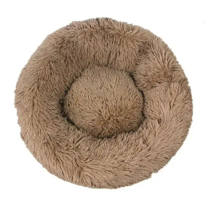 Circular, fluffy pet bed with a raised rim and plush interior.