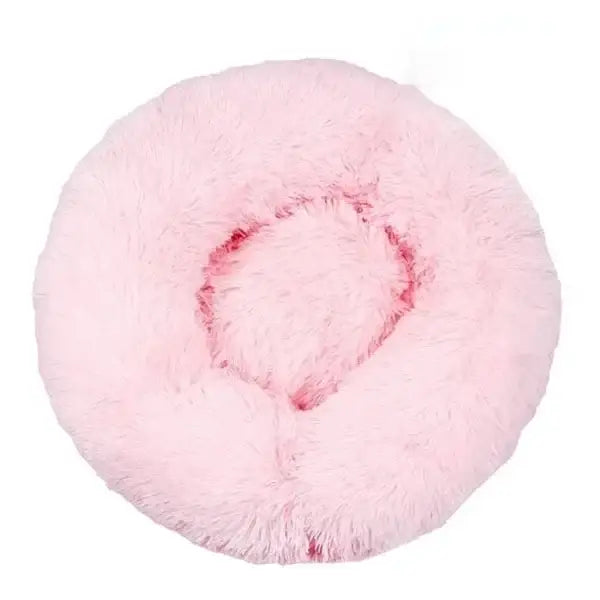 Fluffy pink circular cushion or pillow with a depression in the center.