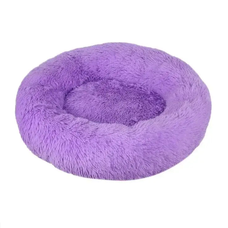 Fluffy purple circular pet bed with a raised edge and sunken center.