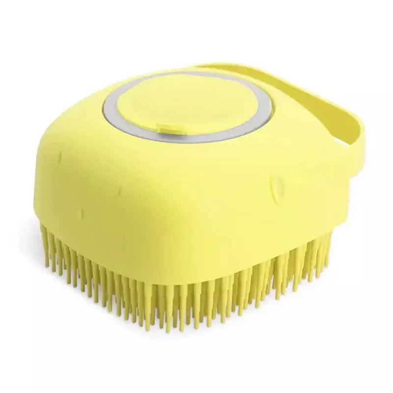 Yellow plastic brush with bristles and a circular handle on top.