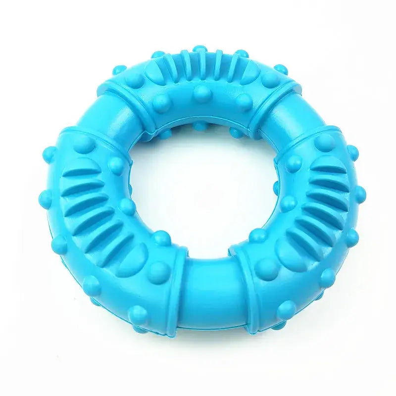 Bright blue circular dog chew toy with textured ridges and nubs.