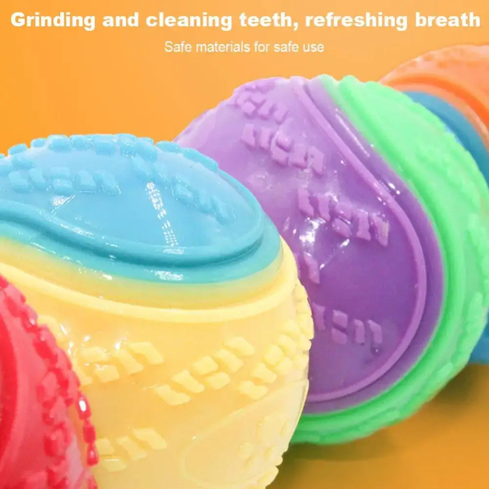 Colorful rubber chew toys or dental balls for dogs with textured surfaces.