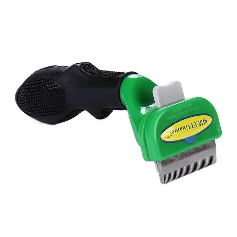 Pet grooming tool with a green handle and black grip, featuring a metal comb or brush attachment.