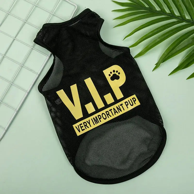 Black dog vest with ’V.I.P. VERY IMPORTANT PUP’ printed in yellow letters.