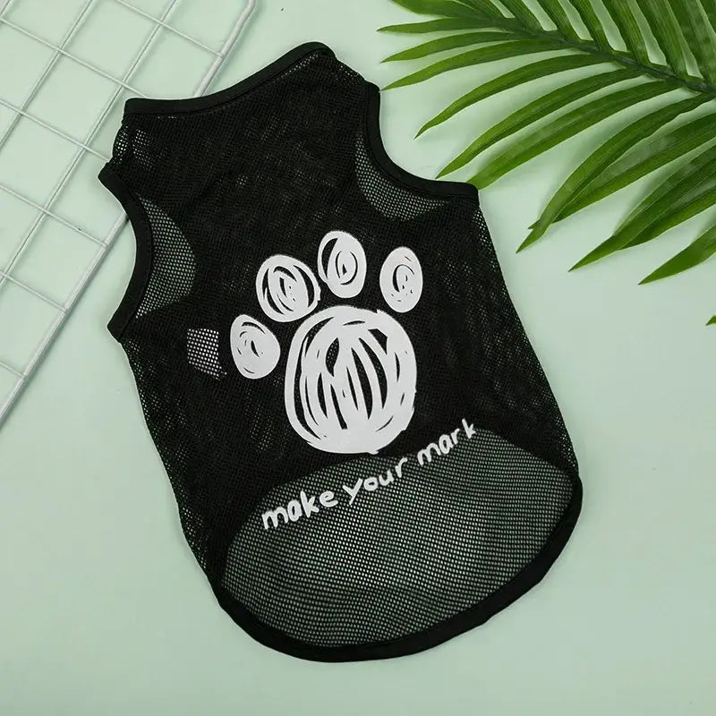 Black mesh dog vest with a white paw print design and text ’make your mark’.