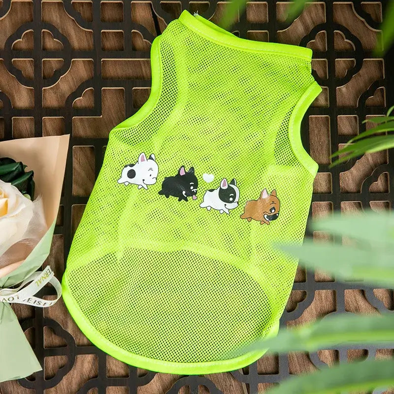 Bright green mesh dog vest with cartoon animal designs.