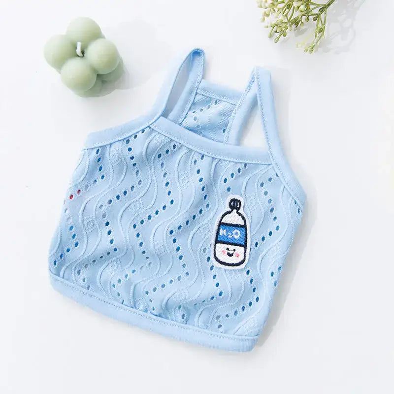 Light blue baby bra or crop top with a cute milk bottle patch and eyelet pattern.