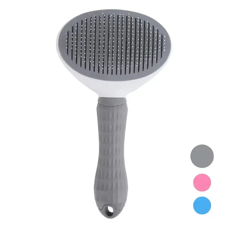 Pet grooming brush with a round head and ergonomic handle.