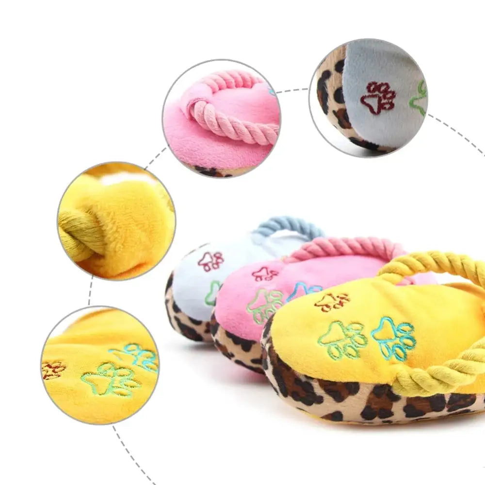 Colorful circular dog toy with rope handles and paw print designs.