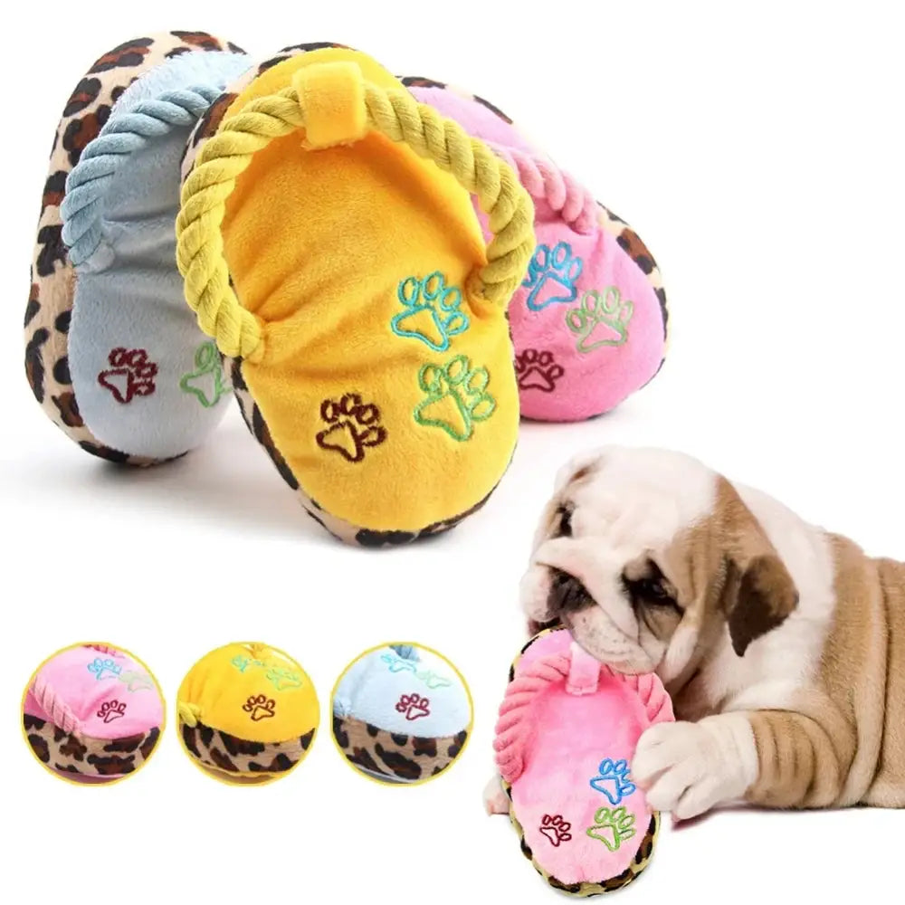 Colorful plush dog slippers with paw print designs and leopard print trim.