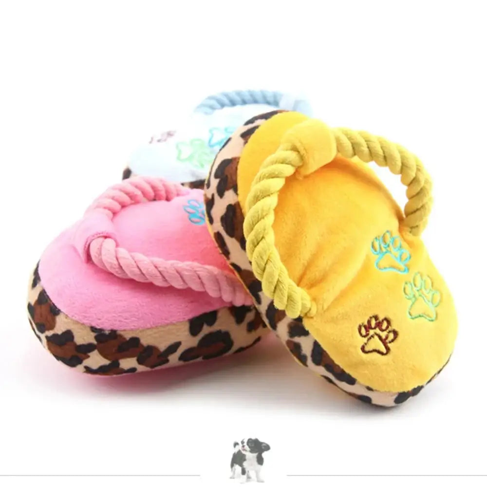 Colorful plush dog toys shaped like slippers with animal print trim.