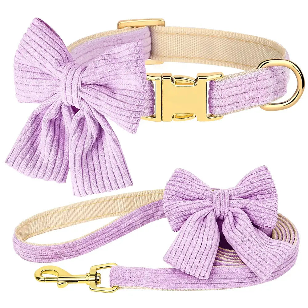 Lavender dog collar and matching leash set with decorative bows and gold hardware.