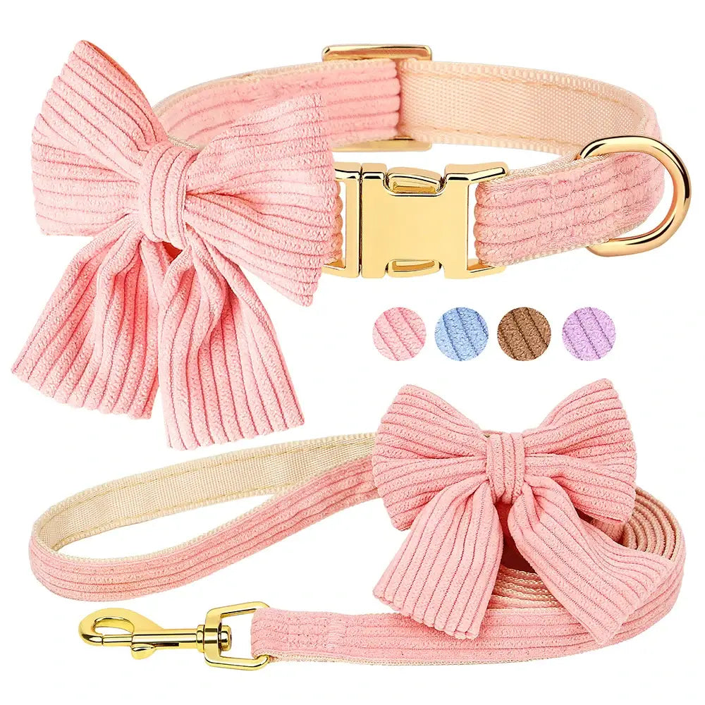 Pink corduroy dog collar and leash set with decorative bows and gold-tone hardware.