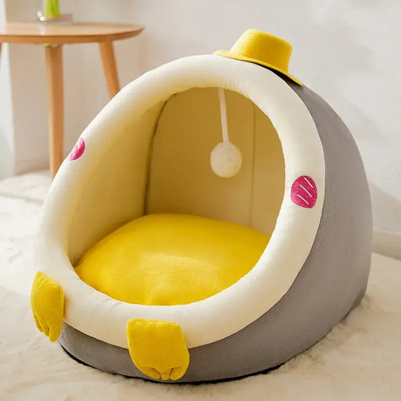 Egg-shaped pet bed with yellow accents designed to look like a chick or bird.