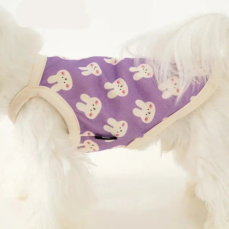 Purple bandana with white rabbit face patterns.