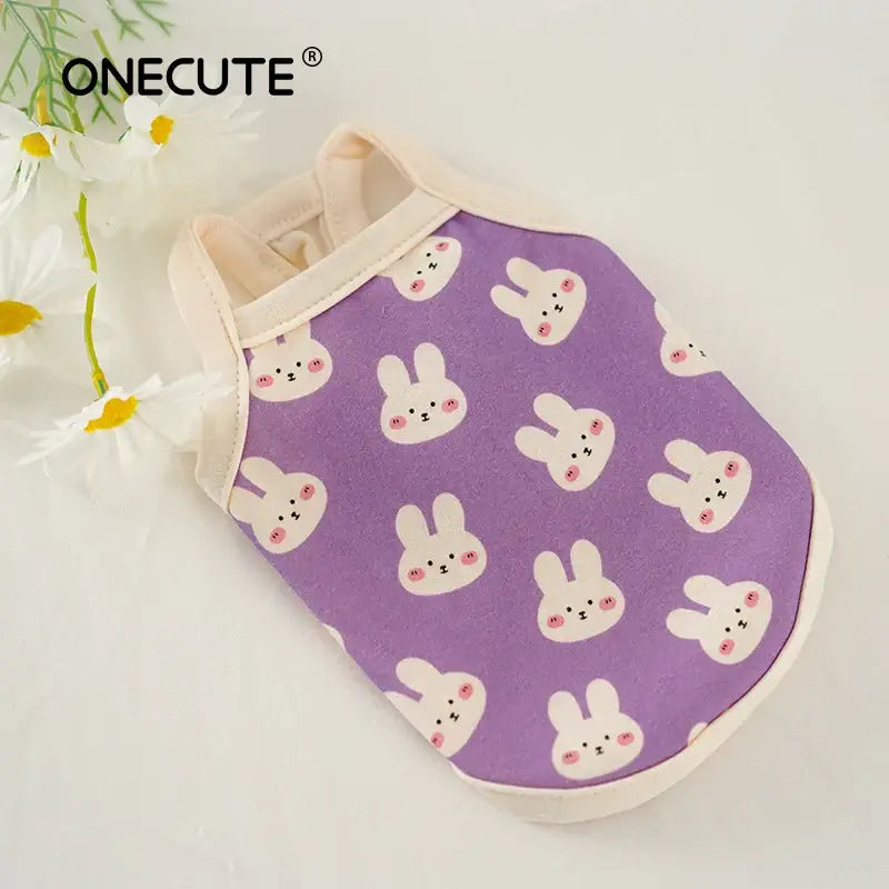 Purple pet clothing with a white bunny rabbit pattern.