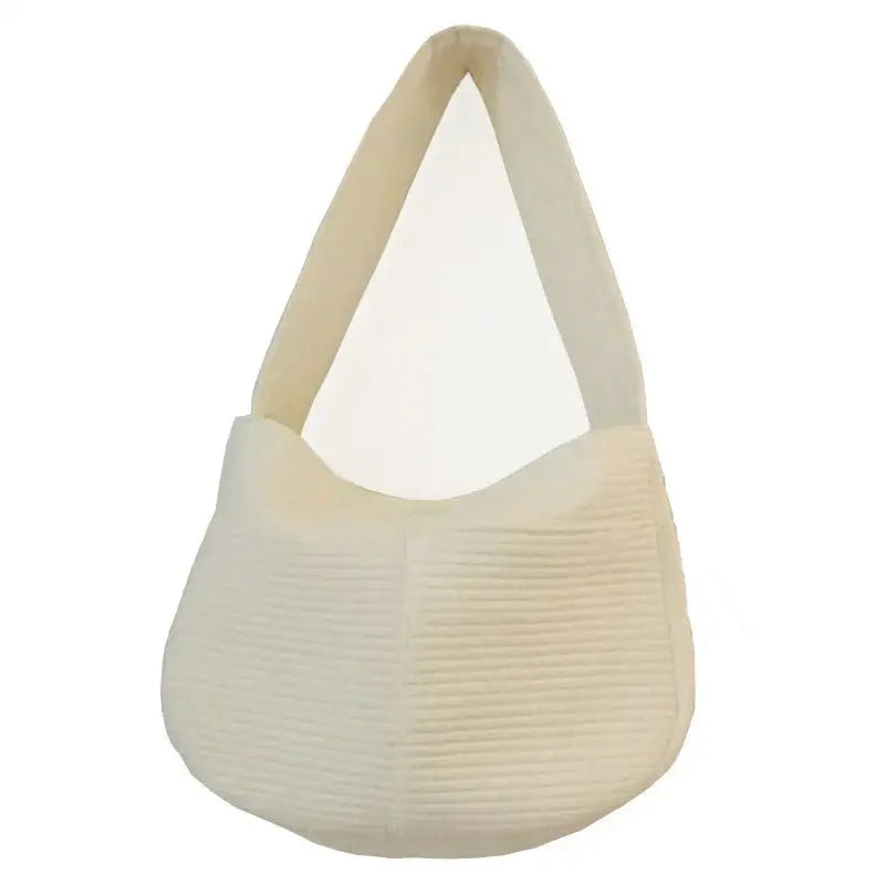 Cream-colored handbag with a textured, ribbed surface and curved shape.