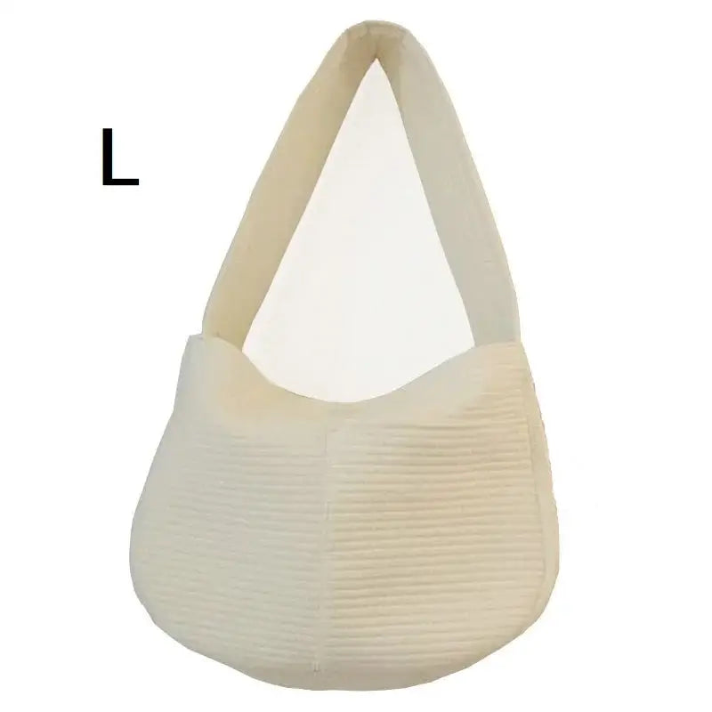 Cream-colored, textured hobo-style handbag with a curved handle.