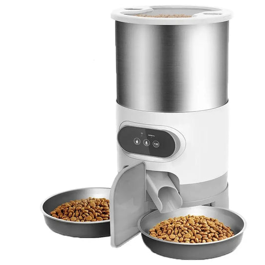 Automatic pet feeder with two food bowls and a cylindrical storage container.