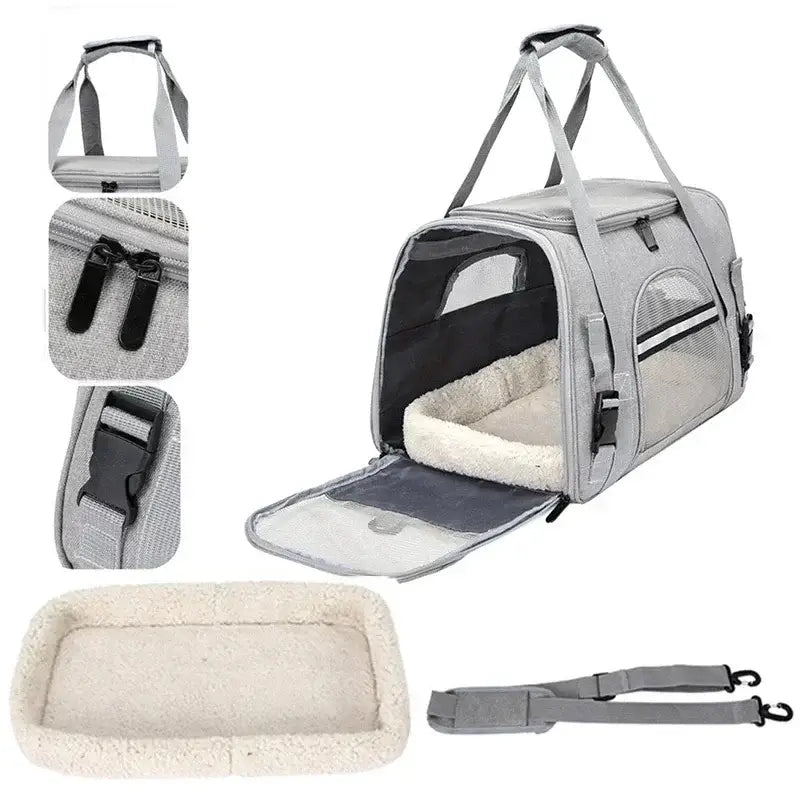 Pet carrier with soft sides, mesh windows, and a removable cushion.