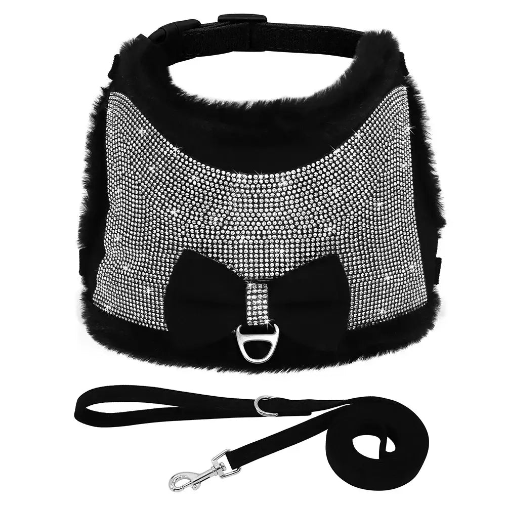 Glittery black and silver dog harness with a bow and attached leash.