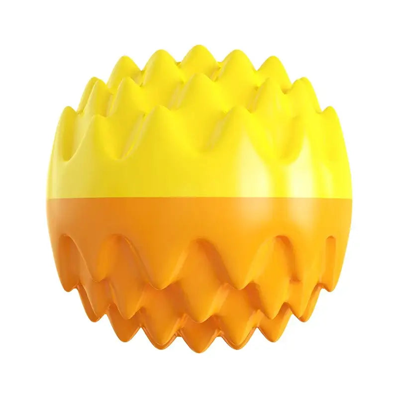 Yellow and orange spherical object with a spiky, textured surface.