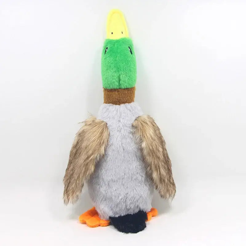 Plush toy duck with a green and yellow head, gray body, and orange feet.