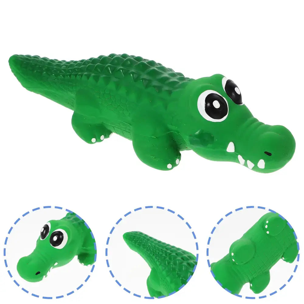 Green cartoon alligator toy with big eyes and a toothy grin.