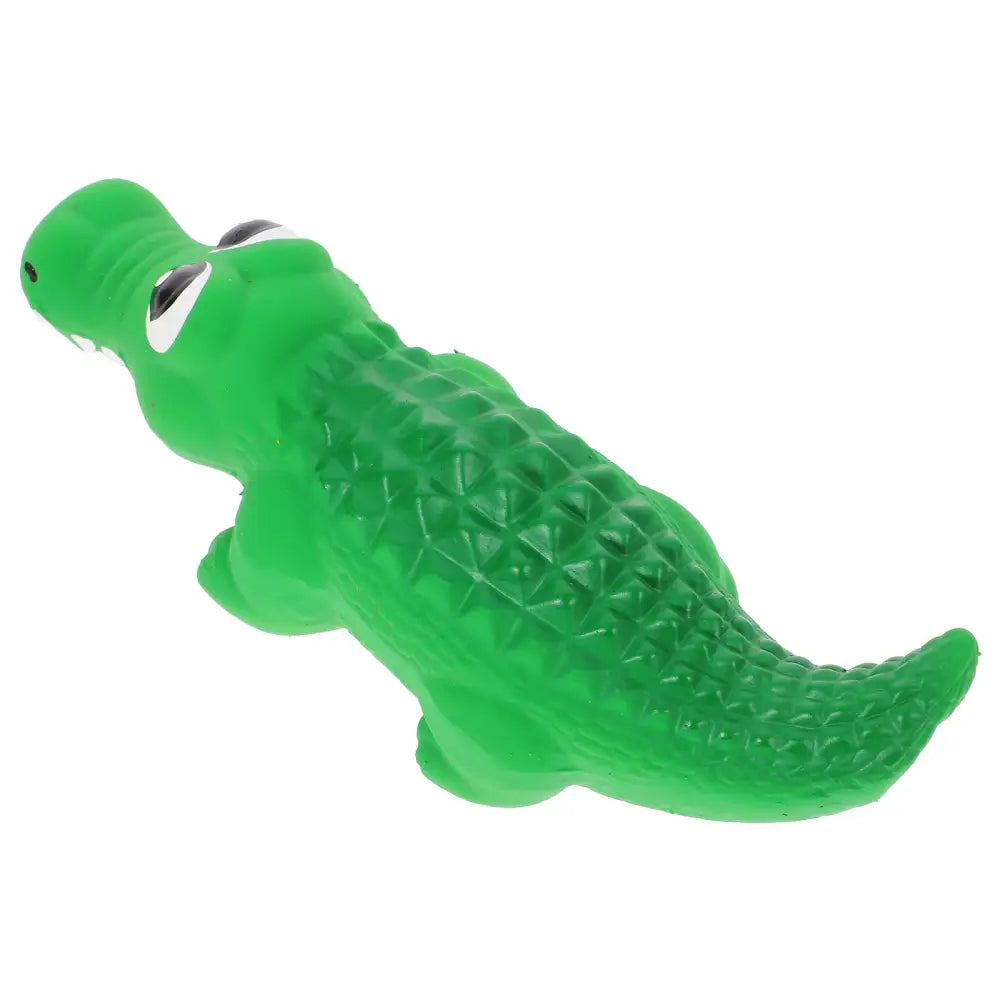 Green plastic toy alligator or crocodile with cartoon-like eyes.