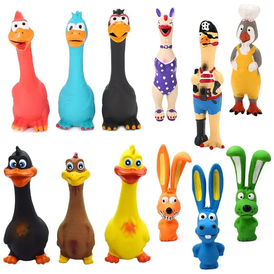 Collection of colorful rubber or plastic toy animals and characters, primarily featuring various bird and duck-like figures along with some rabbits.