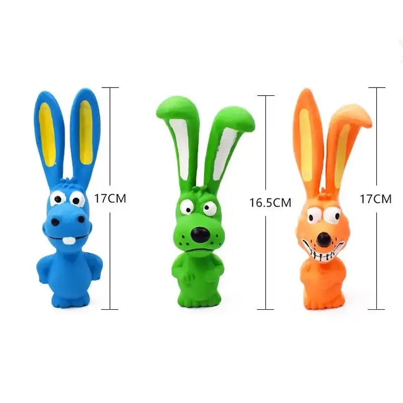 Three colorful cartoon rabbit-like toy figures with elongated ears.