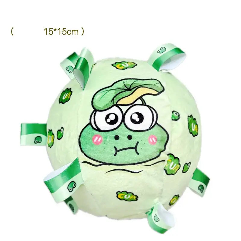 Cartoon-style plush ball with a green frog face and fabric tags around the edges.