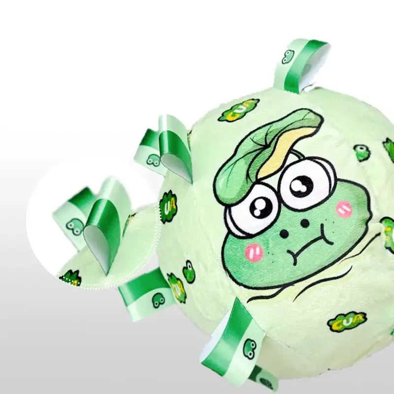 Green cartoon character balloon with a comical face and curled ribbons.