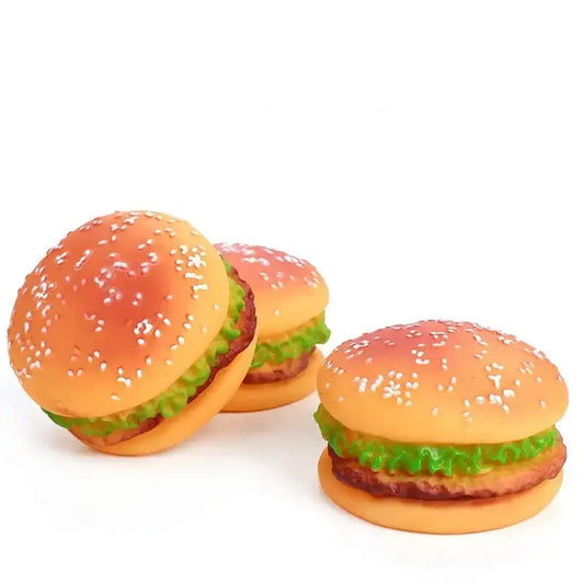 Toy hamburgers made of plastic with sesame seed buns, lettuce, and patties.