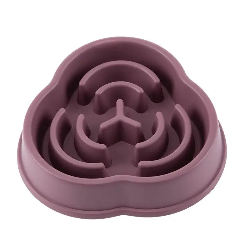 Mauve-colored pet food bowl with a maze-like interior design.