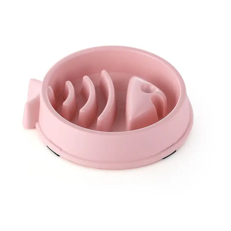 Pink plastic pet food bowl with raised sections to slow eating.