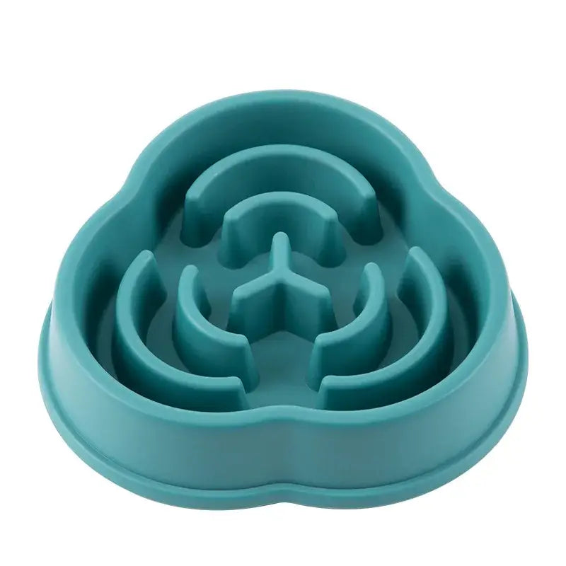 Teal-colored pet food bowl with a maze-like interior design to slow eating.