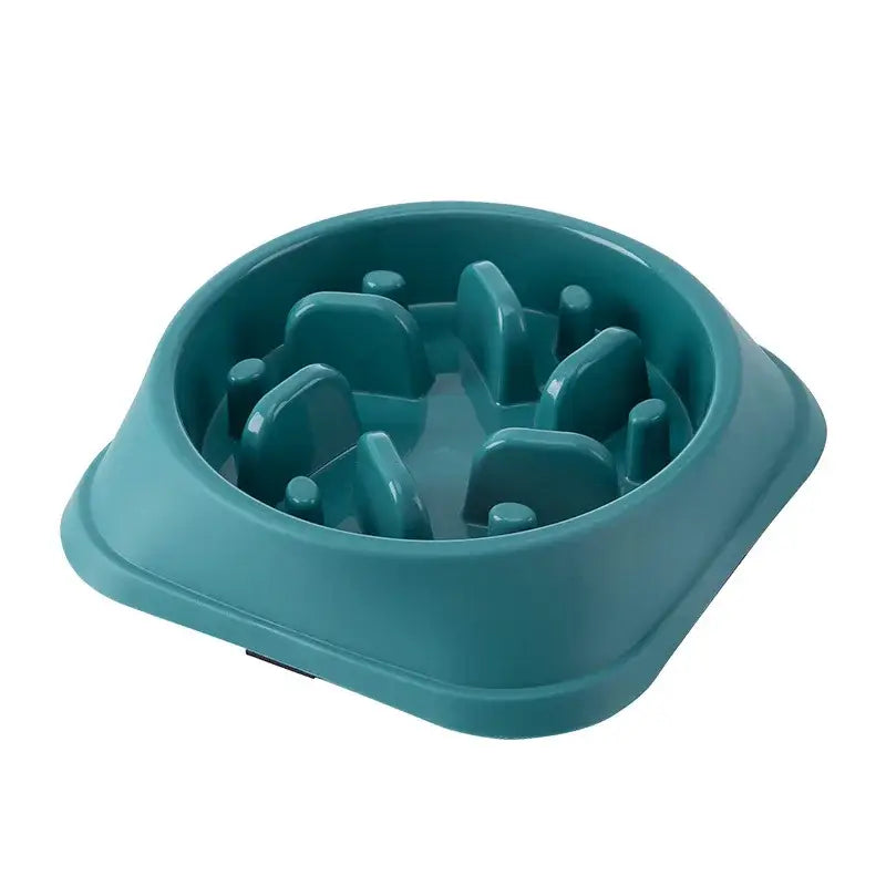 Teal-colored pet food bowl with raised obstacles inside to slow eating.