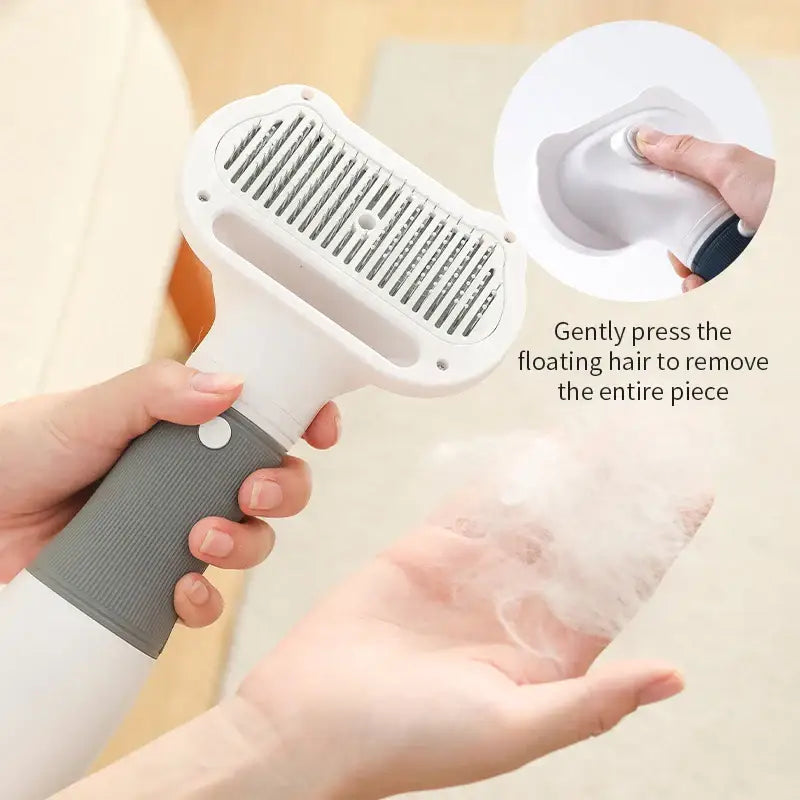 Handheld pet hair removal tool with a detachable brush head.